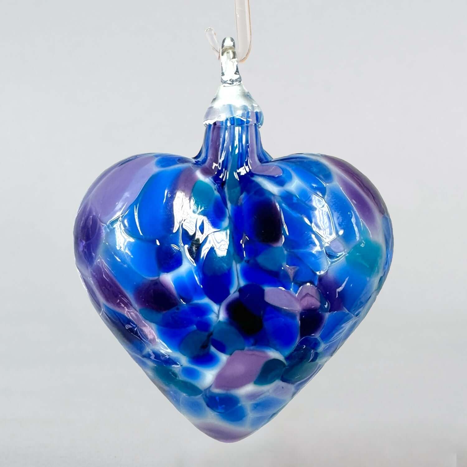 glass heart ornament in hues of purple and blue